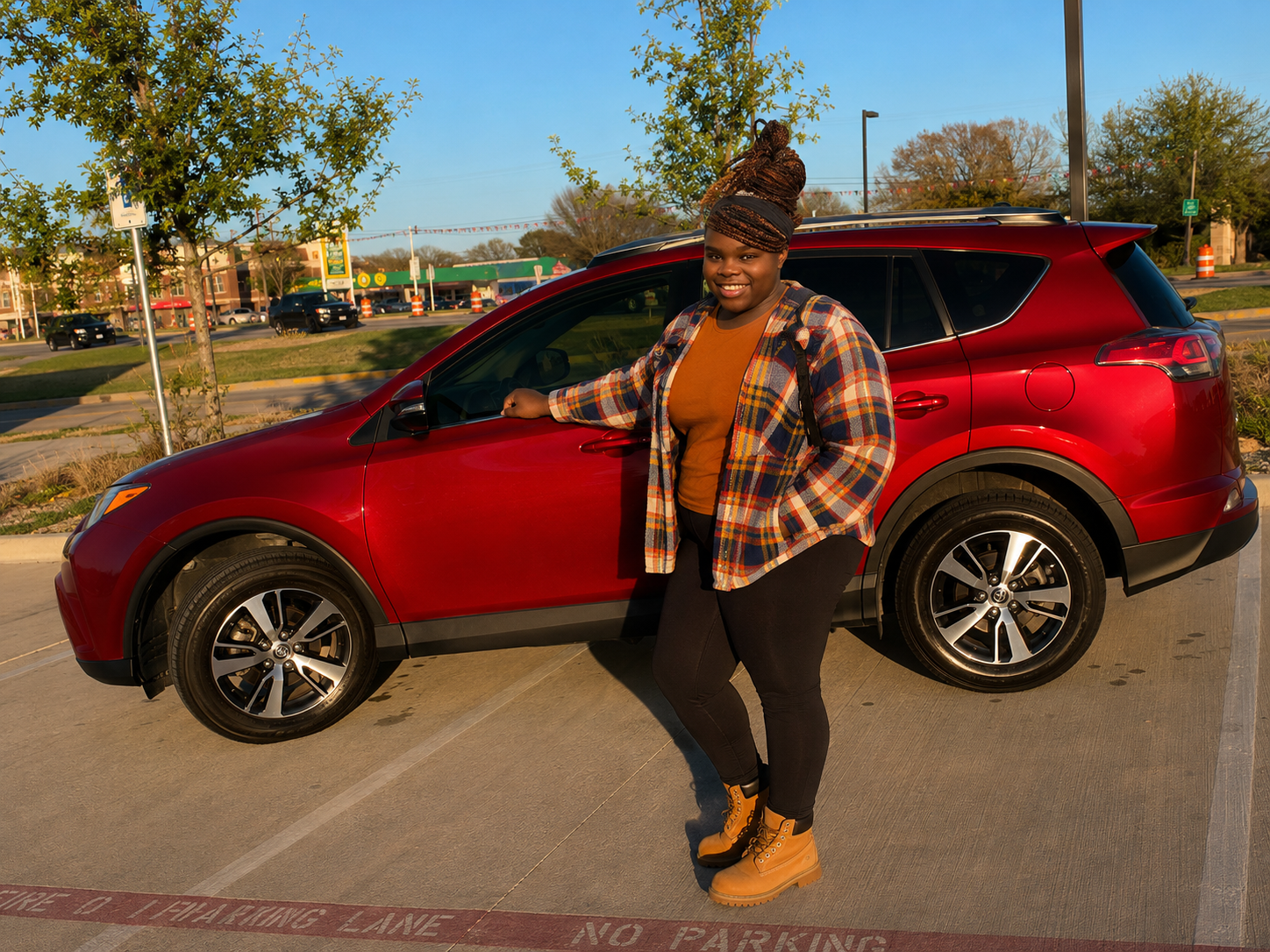 Client celebrating a new vehicle after making progress with K’Lashon Financial Consulting